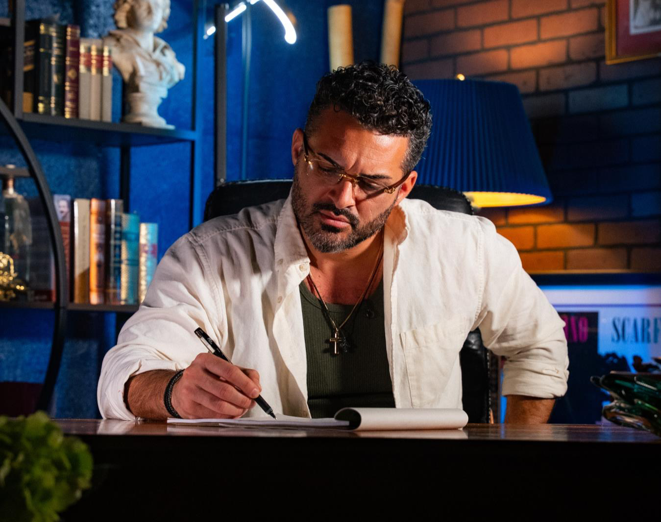 GSTAKIS sketching at his studio desk